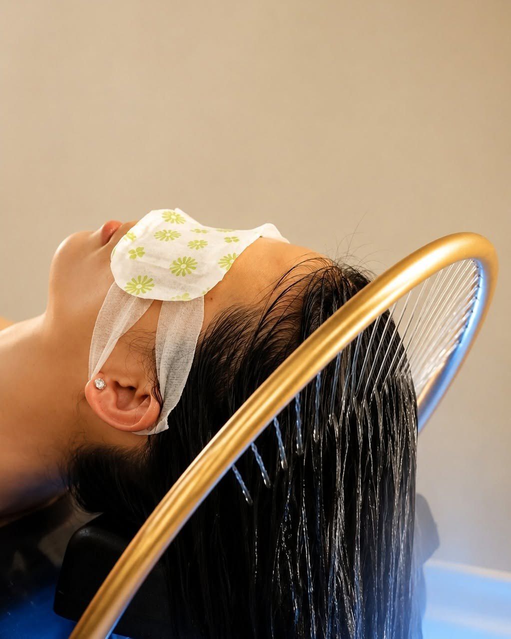 Guest relaxing under the waterfall halo at Gold Class Head Spa Chermside